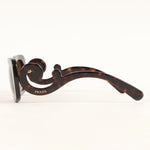 Prada Baroque Swirl Round Glasses